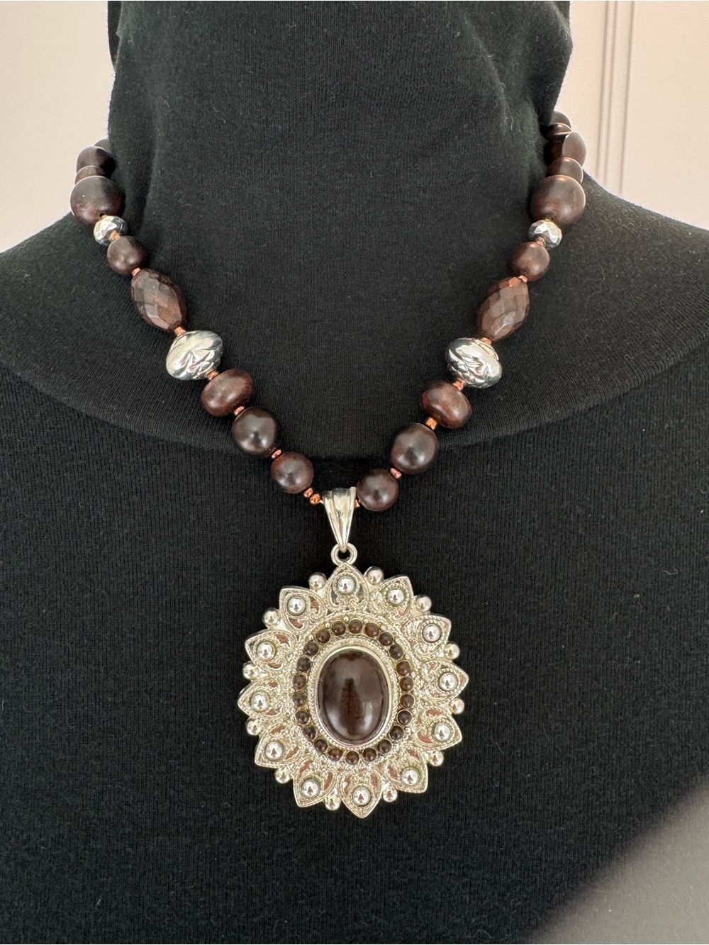 Handcrafted Brown Bead Necklace with Ornate Silver Pendant